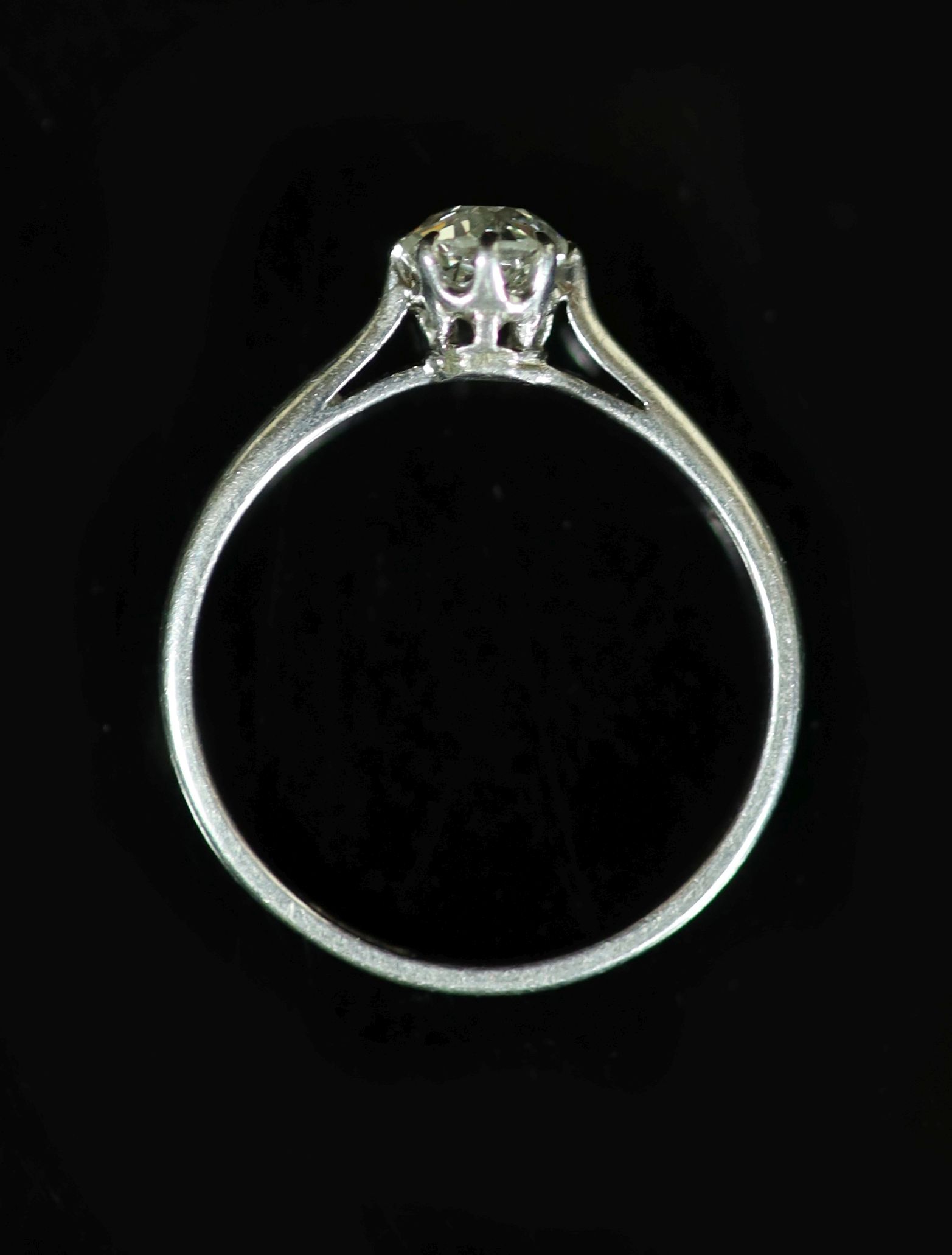 A platinum and diamond solitaire ring, the claw-set circular brilliant cut diamond approximately 0.5ct